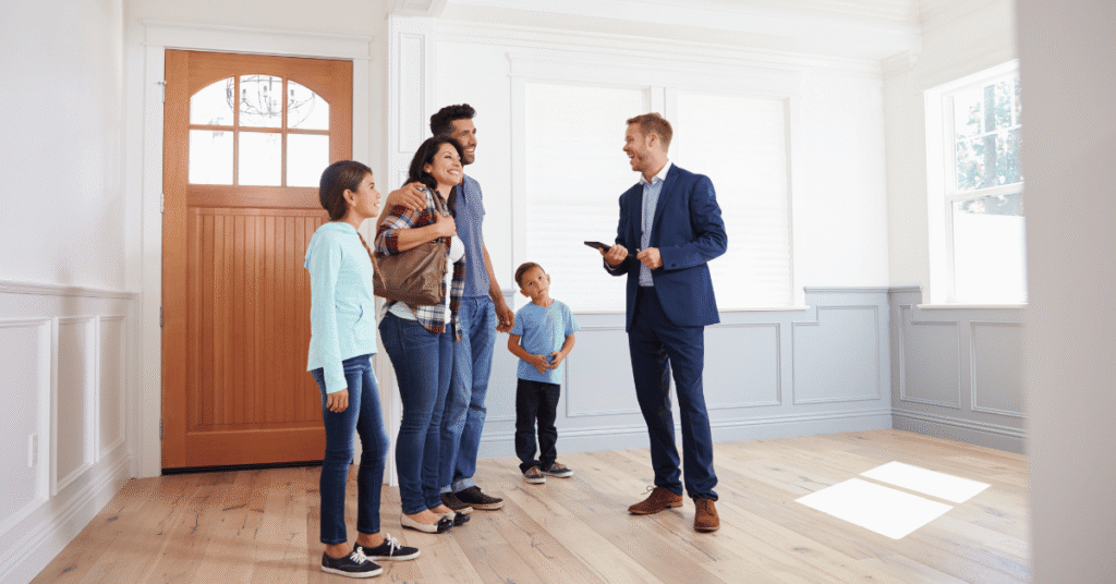 homeowners and realtor reviewing home improvement plans together - The 3 Biggest Mistakes Sellers Make Before Listing Their Home
